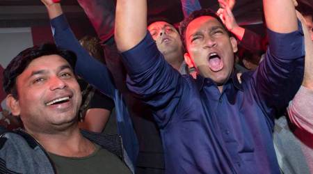 Supporters cheer as they watch results at Liberal party headquarters in Montreal on Monday, Oct. 19, 2015. (Justin Tang/The Canadian Press via AP) MANDATORY CREDIT