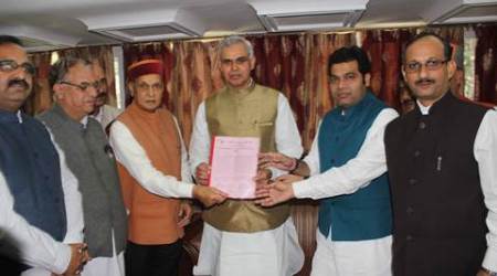 Former Chief Minister and leader of opposition Prem Kumar Dhumal with national BJP secretary and state BJP in-charge Shrikant Sharma other BJP leaders giving memorandum to Governor of Himnachal Pradesh Acharya Devvrat in against the state congress government at Rajbhawan in Shimla on Monday. Express photo by Lalit Kumar. 05.10.2015.