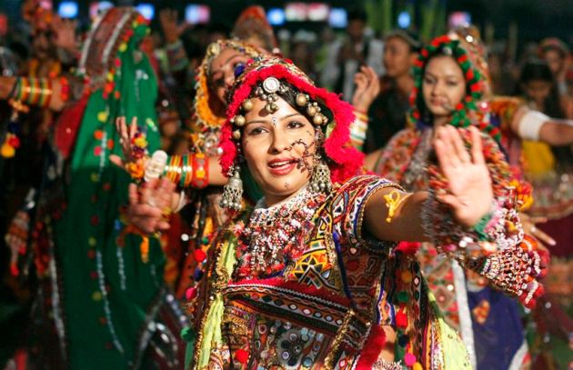 People take part in Dandiya Raas during Garba nights | Picture Gallery ...