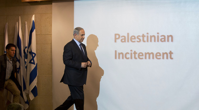 Israeli Prime Minister Benjamin Netanyahu walks during a press conference at the Foreign Ministry in Jerusalem, Thursday, Oct. 15, 2015. Netanyahu on Thursday said he would be "perfectly open" to meeting with Palestinian President Mahmoud Abbas in order to end weeks of Israeli-Palestinian unrest. (AP Photo/Sebastian Scheiner)