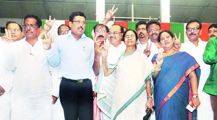 Chief Minister Mamata Banerjee with newly elected mayors, deputy mayors and chairpersons of Bidhannagar and Asansol municipal corporations at Khudiram Anusilan Kendra in Kolkata on Tuesday. (Express Photo by Subham Dutta)