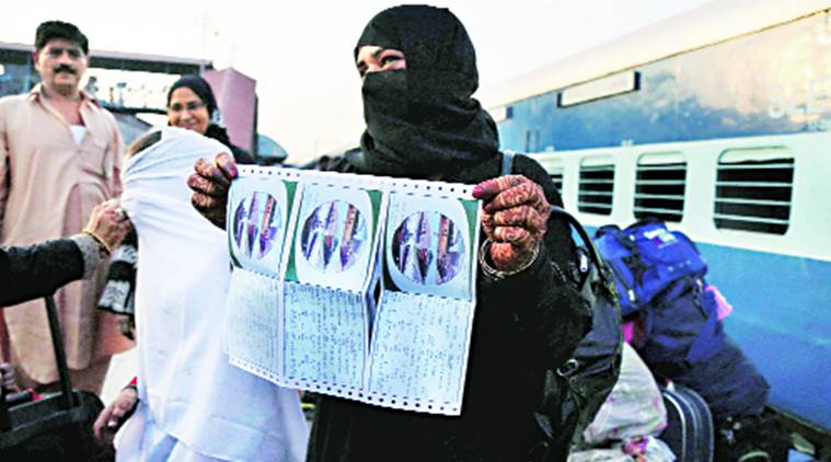 A passenger shows tickets of India-bound Samjhauta Express at Lahore Railway Station. PTI