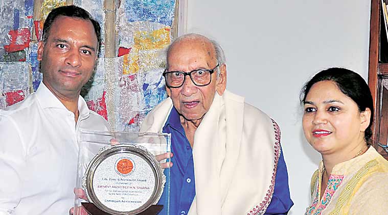 UT Adviser Vijay Dev honours M N Sharma with lifetime achievement award at his residence in Sector 8, Chandigarh, on Sunday. (Sahil Walia)