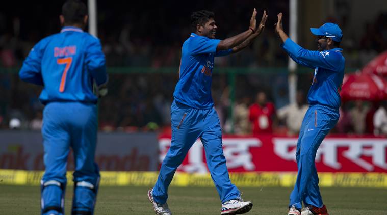 Indian bowler Umesh Yadav, center, celebrates with teammates after claiming a South African wicket in the first of their five one-day match series in Kanpur, India, Sunday, Oct. 11, 2015. (AP Photo/Saurabh Das)