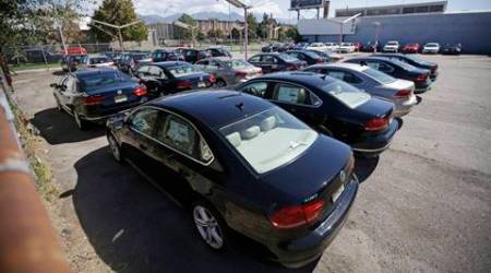FILE - In this Sept. 23, 2015 file photo, Volkswagen diesel cars are parked in a storage lot near a VW dealership in Salt Lake City. Volkswagen almost inevitably will have to compensate owners of diesel cars equipped with emissions-rigging software. Some legal experts say the automaker could be forced to buy back the cars altogether. (AP Photo/Rick Bowmer, File)