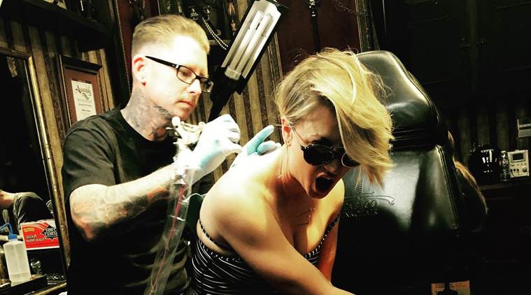 Kaley Cuoco  grey moth upper center spine back tattoo  Celebrity tattoos  Wedding date tattoos Kaley cuoco