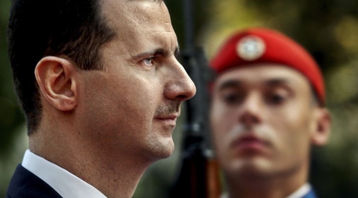 FILE - In this Monday, Dec. 15, 2003 file photo, Syrian President Bashar Assad reviews the presidential guard during a welcoming ceremony in Athens (AP photo)