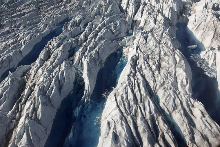 In this file photo, pools of melted ice form atop Jakobshavn Glacier, near the edge of the vast Greenland ice sheet.   Since 1997, the West Antarctic and Greenland ice sheets have lost 5.5 trillion tons of ice (5 trillion metric tons), according to Andrew Shepherd at the University of Leeds, who used NASA and European satellite data.  (AP Photo/Brennan Linsley, File)