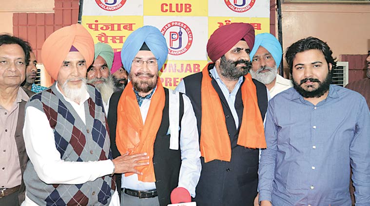 AAP convenor Sucha Chhotepur (extreme left) with Col C D Kamboj (retd) in Jalandhar on Tuesday. (Express Photo)