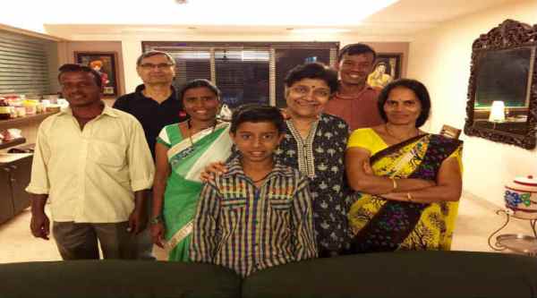 Nithya Shanti's family posing with the maid's family/ Nithya Shanti's Facebook page