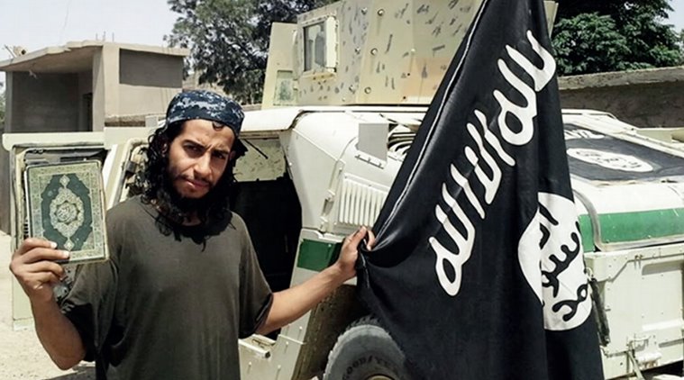 This undated image made available in the Islamic State's English-language magazine Dabiq, shows Belgian national Abdelhamid Abaaoud. Abaaoud, the child of Moroccan immigrants who grew up in the Belgian capitals Molenbeek-Saint-Jean neighborhood, was identified by French authorities on Monday Nov. 16, 2015, as the presumed mastermind of the terror attacks last Friday in Paris that killed over a hundred people and injured hundreds more. (Militant Photo via AP)