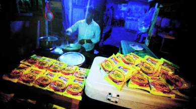 A vendor cooks Maggi noodles in Noida