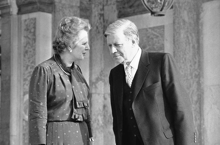 In this file photo Britain's Prime Minister Margaret Thatcher, has a word with West German Chancellor, Helmut Schmidt. AP Photo 