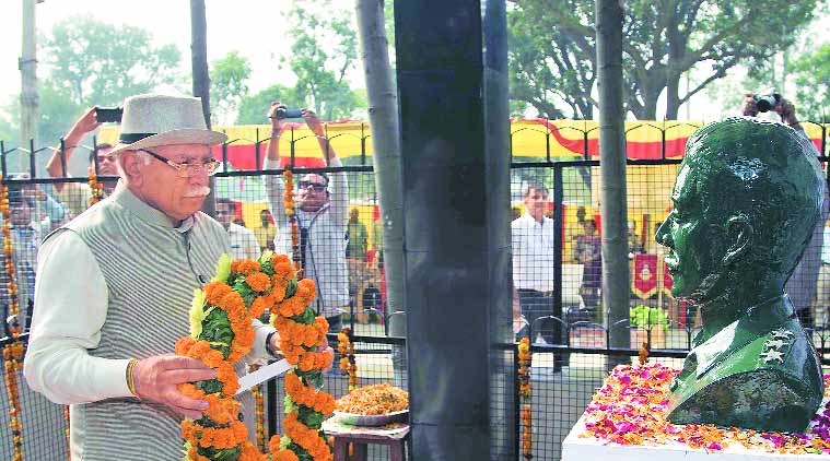 Haryana Chief Minister Manohar Lal Khattar pays tribute to martyr Captain Rohit Kaushal at his memorial at Jalauli village in Panchkula on Tuesday.  (Express Photo)
