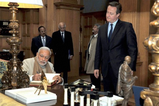 Narendra Modi, Queen Elizabeth II, Modi meets Queen, Modi in UK, Modi Elizabeth gift, Modi UK visit, David Cameron, Modi UK photos, Modi visits UK, Modi London protest, Modi Cameron, Modi 10 downing street, modi david, modi united kingdom, Modi UK Day 1, Modi UK Day 2, India UK relationship, Modi UK pictures, World news
