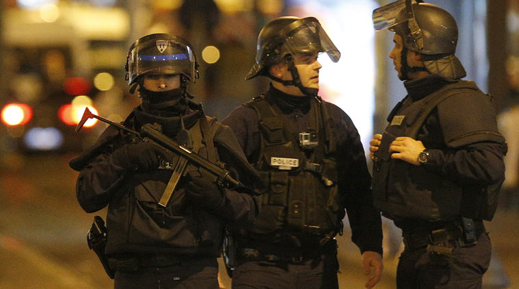 French police raiding a neighbourhood in Saint Denis, northern Paris. (Source: AP)