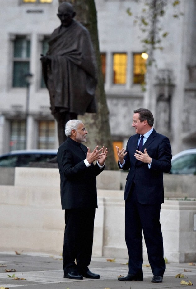 Narendra Modi, David Cameron, Modi in UK, Modi UK visit, Modi UK photos, Modi visits UK, Modi London protest, Modi Cameron, Modi 10 downing street, modi david, modi united kingdom, India UK relationship, Modi UK pictures, World news