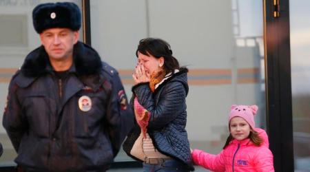 A relative of those on the Metrojet flight that crashed in Egypt react as they gather to grieve at a hotel near St. Petersburg's Pulkovo airport outside St.Petersburg, Russia, Saturday, Oct. 31, 2015. Russia's civil air agency is expected to have a news conference shortly to talk about the Russian Metrojet passenger plane that Egyptian authorities say has crashed in Egypt's Sinai peninsula. (AP Photo/Dmitry Lovetsky)