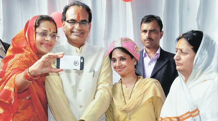 MP CM Shivraj Singh Chouhan and his wife with Geeta, the hearing andspeech impaired woman who returned from Pakistan recently, at an event in Indore on Sunday. (Source: PTI)