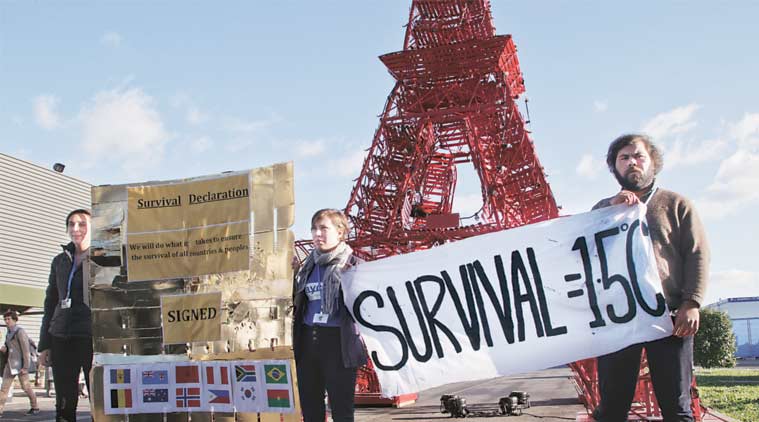 Representatives of NGOs display a banner in Paris Friday. (Source: AP)
