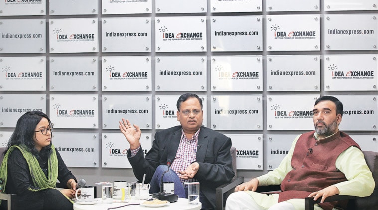 Satyendar Jain (left) and Gopal Rai with Assistant Editor Mayura Janwalkar at The Indian Express office. (Express photo by Ravi Kanojia)