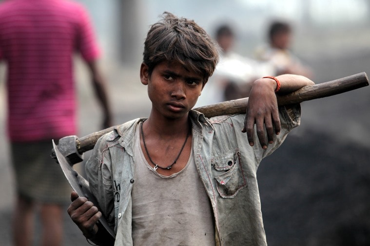 A child labourer works at the Katra railway station to unload coal in Gonda, Uttar Pradesh.Express Photo by Ravi Kanojia