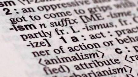 The suffix "ism" is photographed in Merriam-Webster's Collegiate Dictionary, in New York,  Monday, Dec. 14, 2015. Merriam-Webster has picked a small but powerful suffix as word of the year: ism. The top isms to earn high traffic spikes and big bumps in lookups on the dictionary company's website in 2015 over the year before are socialism, fascism, racism, feminism, communism, capitalism and terrorism. (AP Photo/Richard Drew)