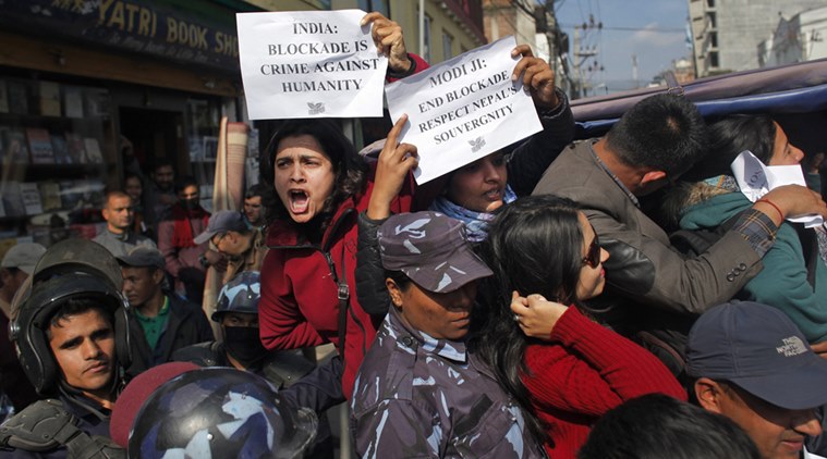 Nepalese activists protesting against India show papers written with their appeal as they are detained by police outside the Indian Embassy in Kathmandu, Nepal, Thursday, Dec. 10, 2015. About 50 activists were detained as they demanded an end to a monthlong blockade of supplies from India.  (AP Photo/Niranjan Shrestha)