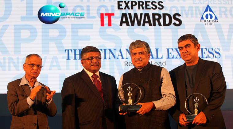 Nandan Nilekani receiving the Lifetime Achievement award from  Ravi Shankar Prasad as NR Narayana Murthy and Vishal Sikka, winner of Newsmaker of the year winner looks on during the Express IT Awards in Bengalore on Dec 4th 2015. Express photo by Ravi Kanojia.