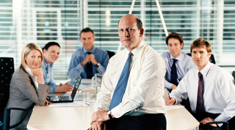Portrait of a CEO With His Team of Business Executives in a Boardroom