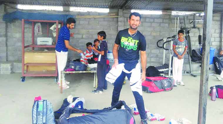 Cheteshwar Pujara at his academy on the outskrits of Rajkot. (Express Photo by: Devendra Pandey)