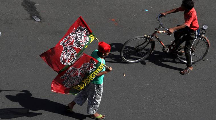 A Young Child holds Samajwadi Party's symbol Flag during party organised Road show in Lucknow on Monday. Express Photo by Vishal Srivastav. 28.04.2014.