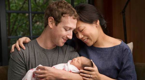 Mark Zuckerberg and wife Priscilla Chan with their daughter Max/ AP