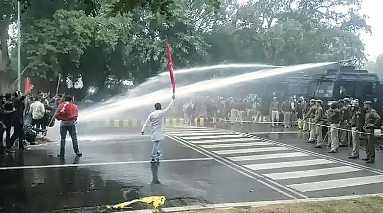 Police use water cannons to disperse the protesters Wednesday. (Source: Express photo by Aranya Shankar)