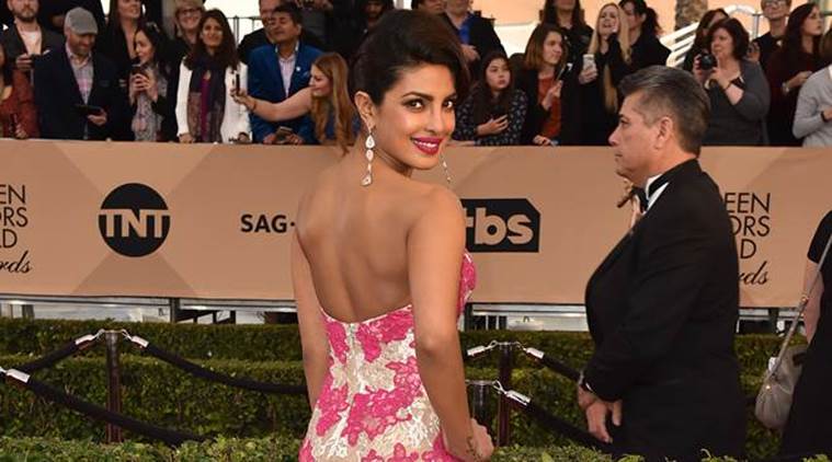 priyanka chopra mermaid dress Priyanka Chopra Jonas recently dazzled at the Bulgari Eclettica High Jewelry event in Milan, wearing a sculptural black mermaid gown and an emerald choker alongside stars like Anne Hathaway and Dua
