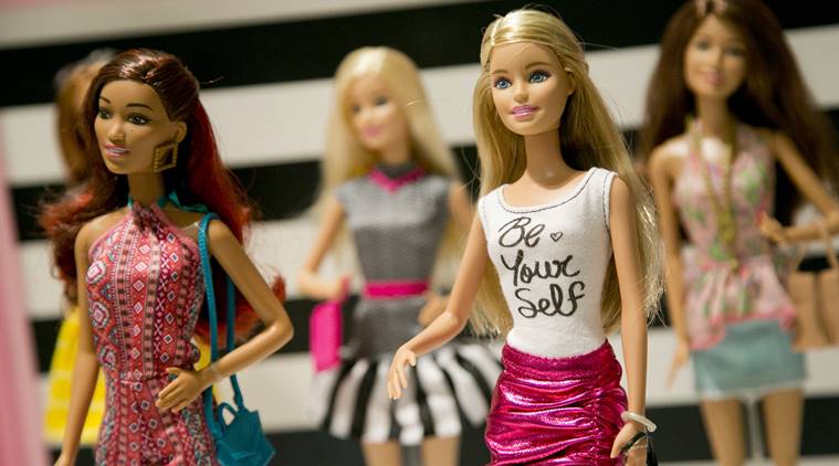 FILE - In this Sept. 29, 2015, file photo, Barbie Fashionista Dolls from Mattel are displayed at the TTPM Holiday Showcase in New York. Mattel Inc., the maker of the famous plastic Barbie doll, says it will st