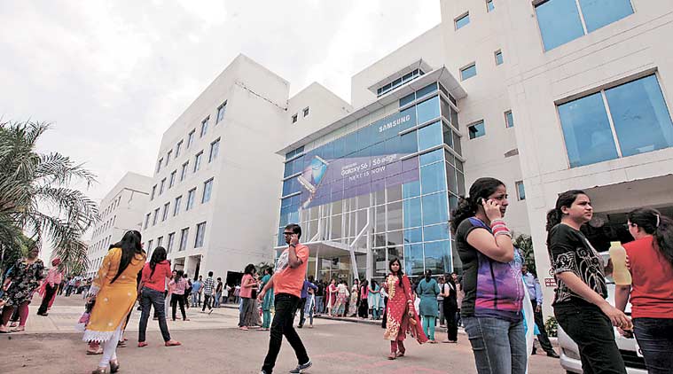 Employees at IT Park come out on the street after tremors were felt in Chandigarh last year.  (Express Archives)