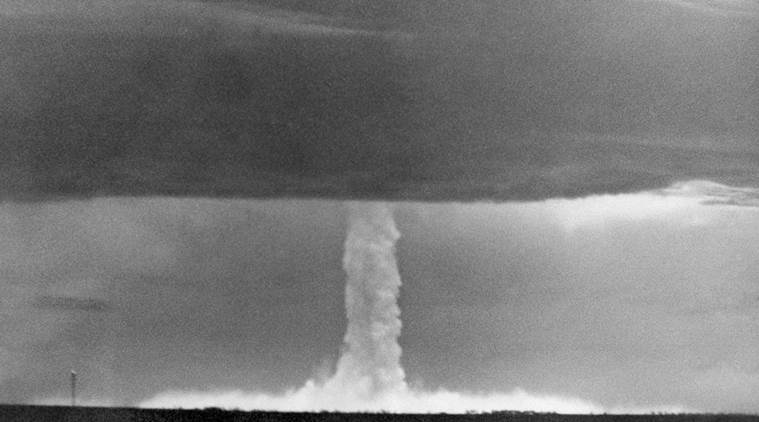 FILE - In this  May 21, 1956 file photo, the stem of a hydrogen bomb, the first such nuclear device dropped from a U.S. aircraft, moves upward through a heavy cloud and comes through the top of the cloud, after the bomb was detonated over Namu Island in the Bikini Atoll, Marshall Islands. The hydrogen bomb was never dropped on any targets. It was first successfully tested in the 1950s by the U.S., in bombs called Mike and Bravo. Soviet tests soon followed. (AP Photo, File)