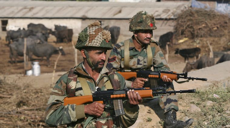 Indian army soldiers stand guard near the Indian Air Force (IAF) base at Pathankot in Punjab, India, January 3, 2016. A gold medal-winning Indian shooter was among 10 people killed in an audacious pre-dawn assault on the air force base, officials said on Sunday as troops worked to clear the compound near India's border with Pakistan after a 15-hour gunbattle. REUTERS/Mukesh Gupta