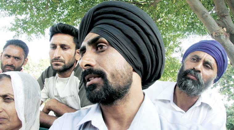 A survivor of the Malta boat tragedy along with relatives of some of the dead in Punjab in 2007. (Express Archive)