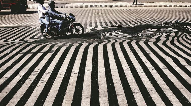 Melted road due to heat in New Delhi. (Express photo by Praveen Khanna)