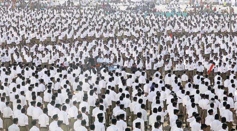RSS chief Mohan Bhagwat inspects the swayamsevaks during a conclave, near Hinjewadi. (Express Photo by Pavan Khengre)