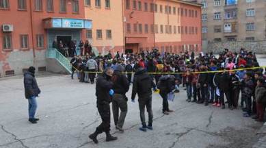 Turkish police officers search for evidence as schoolchildren look on, at a school in the mainly-Kurdish city of Diyarbakir, southeastern Turkey, Friday, Jan. 22, 2016. Suspected Kurdish militants hurled a hand-made explosive device at the school, injuring five students, officials said. Fighting between the PKK and the security forces reignited in July, shattering a two-year old peace process that had aimed to end the three-decade old conflict which has killed tens of thousands of people. (Depo Photos via AP) TURKEY OUT