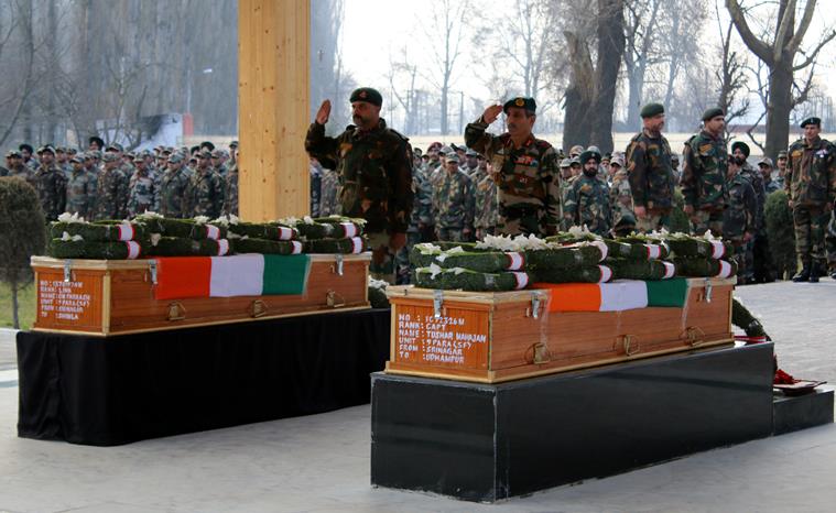 GOC 15 Corps Satish Dua offers tribute to Captain Tushar Mahajan and Lance Naik who were killed during an encounter with militants at Pampore south kashmir on Monday. The encounter that started on saturday (FEB 20) entered third day on Monday. (EXPRESS PHOTO BY SHUAIB MASOODI)