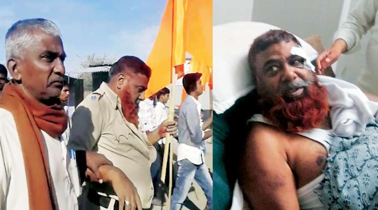 ASI Yunus Sheikh being paraded with the saffron flag; admitted to a hospital in Latur, Maharashtra.