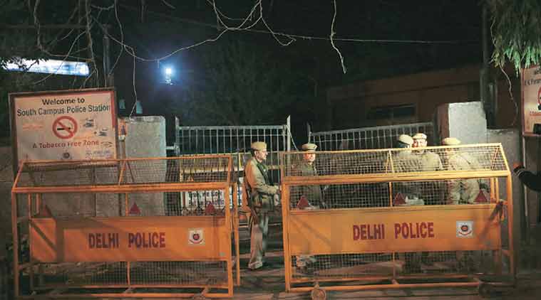 Additional policemen deployed outside R K Puram police station. (Express Photo: Tashi Tobgyal)