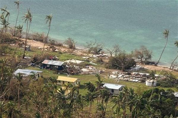 In this Sunday, Feb. 21, 2016 aerial photo supplied by the New Zealand Defense Force, debris is scattered around damaged buildings at Susui village in Fiji, after Cyclone Winston tore through the island nation. Fijians were finally able to venture outside Monday after authorities lifted a curfew but much of the country remained without electricity in the wake of a ferocious cyclone that left at least six people dead and destroyed hundreds of homes. (New Zealand Defense Force via AP) EDITORIAL USE ONLY