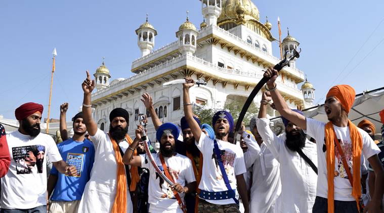 Sikh youth flashing swords and raising slogans in praise of Khalistan taking round of Parikarma of Golden Temple on the occasion of anniversary of Operation Bluestar on Saturday, June 6 2015. EXPRESS PHOTO BY RANA SIMRANJIT SINGH