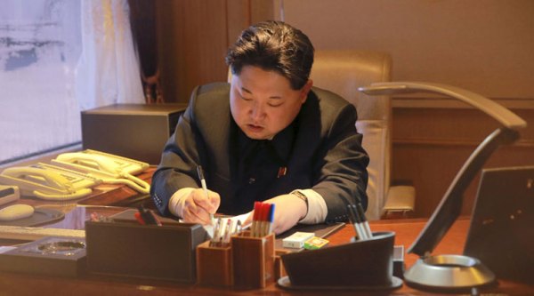 North Korean leader Kim Jong Un signs a document regarding a long range rocket launch in this undated photo released by North Korea's Korean Central News Agency (KCNA) in Pyongyang February 7, 2016. REUTERS/KCNA