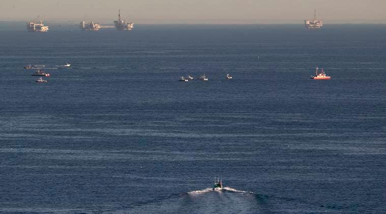 Rescue boats search for wreckage from two small planes that collided in midair and plunged into the ocean off of Los Angeles harbor Friday, Feb. 5, 2016, in San Pedro, Calif. There was no immediate word of any survivors, authorities said. The planes collided at around 3:30 p.m. and apparently went into the water about two miles outside the harbor entrance, U.S. Coast Guard and other officials said. (AP Photo/Damian Dovarganes)